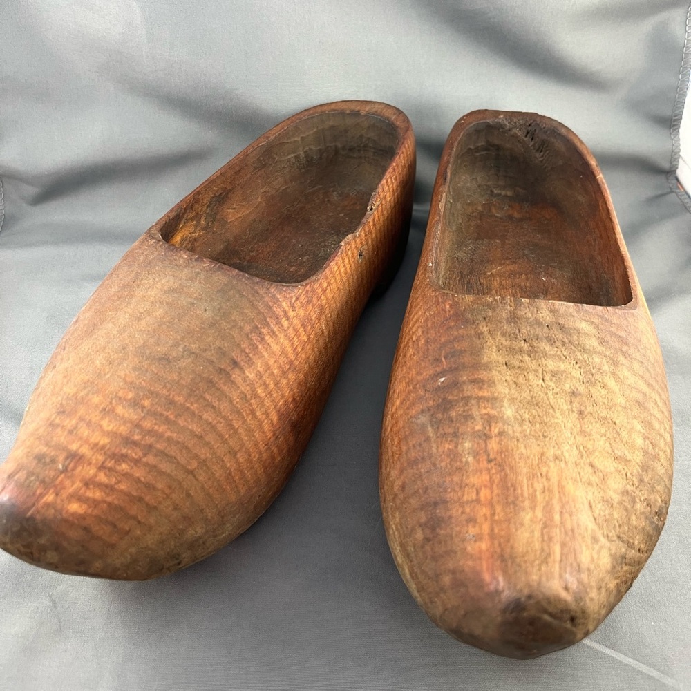 Very Old Wooden Dutch shoes. 
Length 10 1/4” in
Note chip on side of one shoe.
